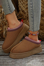 Lade das Bild in den Galerie-Viewer, Pair of brown Contrast Print Suede Plush Lined Snow Boots worn with light wash skinny jeans, featuring a cozy plush lining and decorative stitching around the ankle.