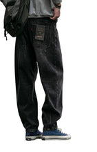 Load image into Gallery viewer, SHADOW FASHION CLOTHING men's loose-fit black denim harem pants in a casual streetwear style with a button fly.