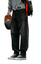 Load image into Gallery viewer, SHADOW FASHION CLOTHING men's loose-fit black denim harem pants with a casual streetwear style and button fly closure.
