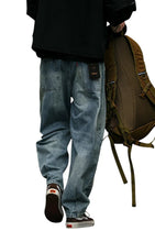 Load image into Gallery viewer, SHADOW FASHION CLOTHING men's loose-fit blue denim harem jeans with a casual streetwear aesthetic, back view.