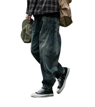 Load image into Gallery viewer, SHADOW FASHION CLOTHING men's loose-fit denim harem pants in a vintage washed blue, styled for a casual streetwear look.