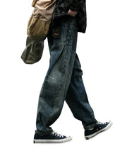Load image into Gallery viewer, SHADOW FASHION CLOTHING men's loose-fit denim harem pants in a vintage blue wash, styled for a casual streetwear look.