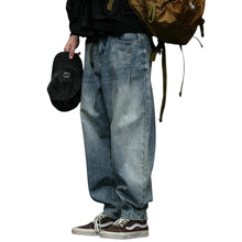 Load image into Gallery viewer, SHADOW FASHION CLOTHING men's loose-fit denim harem pants in a vintage blue wash, styled for a casual streetwear look.