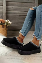 Lade das Bild in den Galerie-Viewer, Black slip-on Contrast Print Suede Plush Lined Snow Boots worn with distressed blue jeans featuring pearl embellishments on the hems, styled in a cozy indoor setting.
