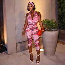 Load image into Gallery viewer, Two piece set of tight fitting seven part jumpsuit with deep V-neck print and headband
