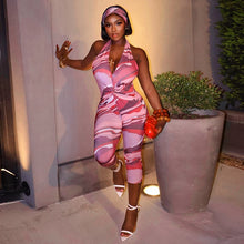 Load image into Gallery viewer, Two piece set of tight fitting seven part jumpsuit with deep V-neck print and headband
