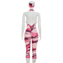 Load image into Gallery viewer, Two piece set of tight fitting seven part jumpsuit with deep V-neck print and headband
