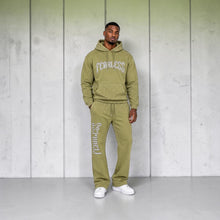 Load image into Gallery viewer, SHADOW FASHION CLOTHING olive green Fearless hoodie and sweatpants set with shimmering rhinestone accents on a male model
