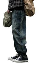 Load image into Gallery viewer, SHADOW FASHION CLOTHING men's loose-fit denim harem pants in a vintage blue wash, styled for a casual streetwear look.
